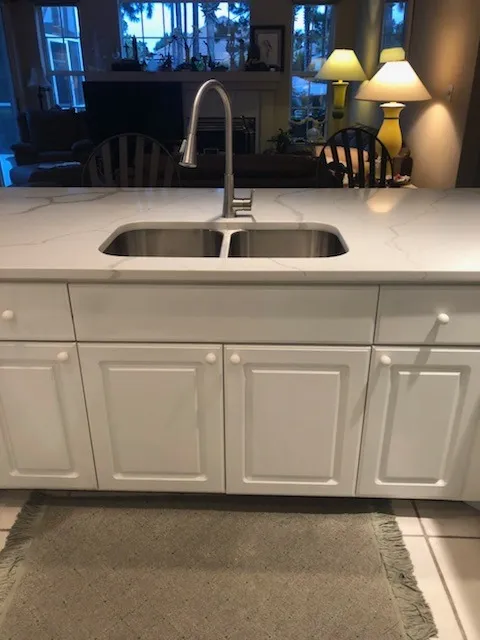 Veined marble kitchen countertop with island