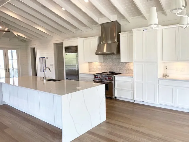 Polished granite countertop with farmhouse sink